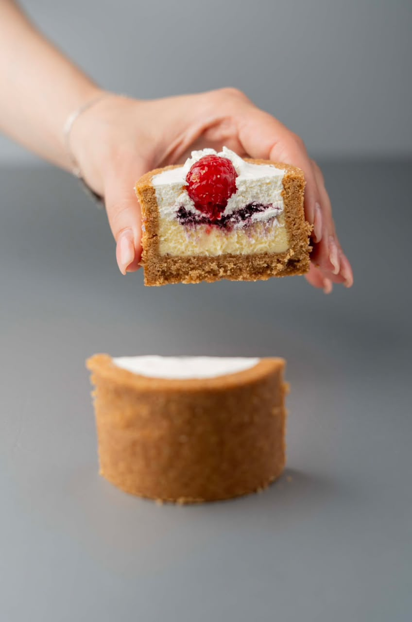 Close up of individual desserts displayed in a bakery